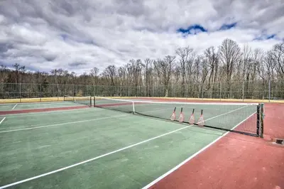 two tennis nets on a tennis court at Woodland Hideout near Ski Adventures in Pleasant Mount