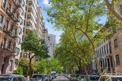 a city street with cars parked on the street at Beautiful 1-Bedroom in the Upper East Side in New York