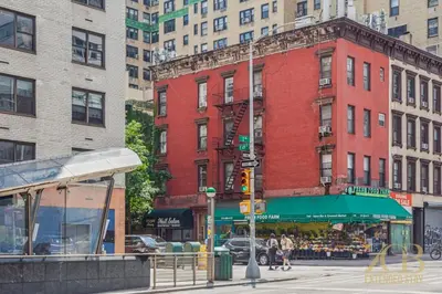 a city street with buildings and a traffic light at Sweet and Cozy 1 Bedroom Apt in Lenox Hill in New York