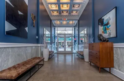 a lobby with a bench and blue walls at Relaxing studio perfect for extended visits in New Haven