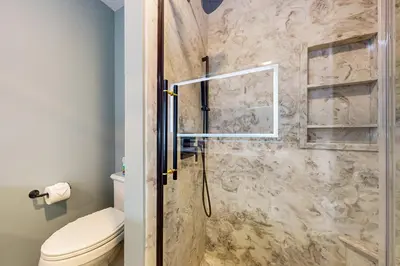 a bathroom with a shower with a toilet at Centrally Located Home by Holyoke Medical Center in Holyoke