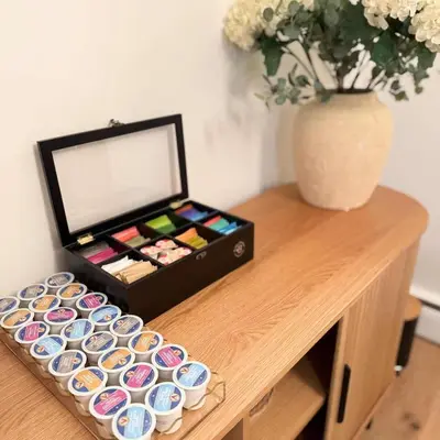 a box of paint on a wooden table with a vase at Renovated Retreat with Heated Pool in Redding