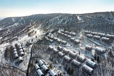 an aerial view of a snow covered city with buildings at Mountain View Memories at Northridge in Tannersville
