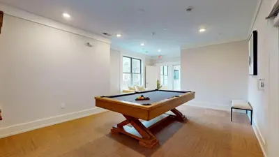 a billiard table in a room with a wall at Stylish Home and Cozy200 in Stamford