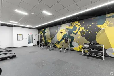 a gym with a mural of a person on a surfboard at Landing Chic 1BD Pool Game Room in Hartford