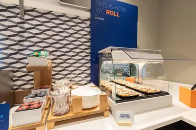 a display case with donuts and other pastries at Holiday Inn Express Branford-New Haven by IHG in Branford