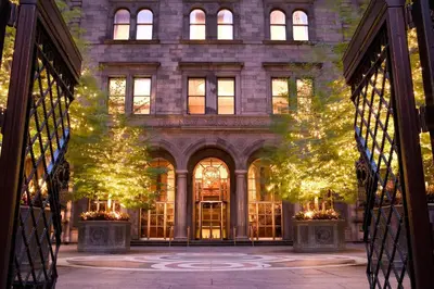a building with christmas lights in front of it at Lotte New York Palace in New York