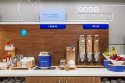 a kitchen with a counter with food items on it at Holiday Inn Express and Suites Dickson City by IHG in Dickson City