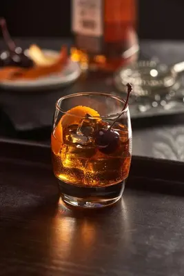 a glass of alcohol with a drink and fruit at Hyatt Place New York/Midtown-South in New York