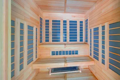 a sauna with wooden walls and wooden floors and windows at Primely Located Dover Escape Less Than 1 Mi to Mt Snow! in Dover