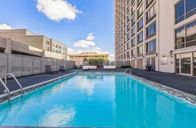 a swimming pool in the middle of a building at Fully Furnished Studio Wifi GYM Free Parking in Hartford