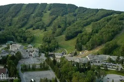 an aerial view of a town in the middle of a mountain at Deluxe Ski On Off 1BR Suite Sleeps 4 on Jiminy Mtn in Hancock