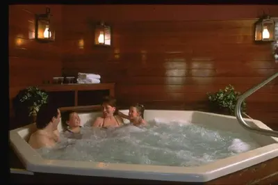 a group of people in a bath tub at Spacious 3BR 3BA Sleeps 8 Ski On Off Jiminy Mountain Resort in Hancock