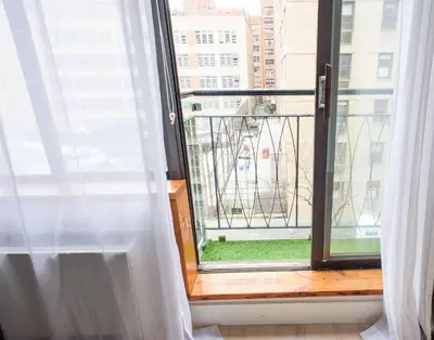 a window with a view of a city at 75-1C New 1BR prime UES W D the unit Best Value in New York