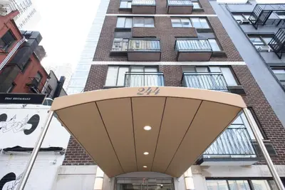 a tall building with a sign in front of it at 75-1B NEW Prime Upper East W D Elevator in New York