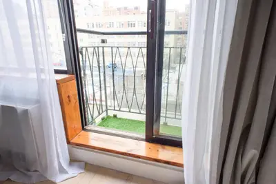 a window with a view of a city at 75-2D NEW Prime UES W&D Balcony Elevator in New York