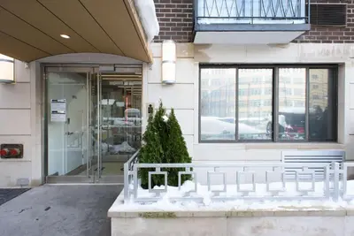 a christmas tree in front of a building at 75-4C New Duplex 3BR W D Elevator Walk to C park in New York