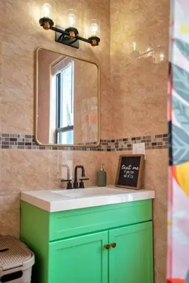 a bathroom with a green sink and a mirror at Green N' Groovy in the Heart of East Rock Near DT, Yale in New Haven