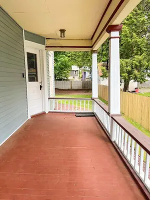 a front porch of a house with a white door at After the Game Apt 1 All Star Baseball Rentals in Oneonta