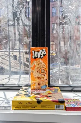 a box on top of a book on a window sill at SWJ 1st - Near Most Attractions Walk to Train Times Sq near in New York