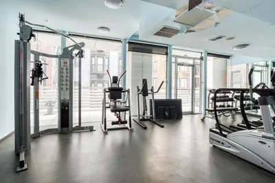 a gym with treadmills and elliptical machines at Midtown 1br w doorman gym wd nr Rock Center NYC-1127 in New York